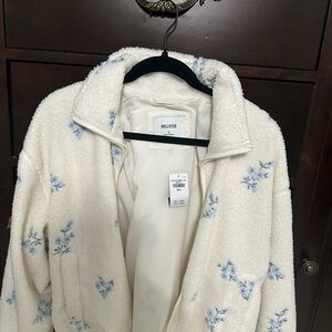 Hollister Women's Cream Teddy Jacket with Blue Floral Design